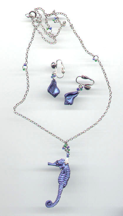 Polymer clay seahorse necklace.
